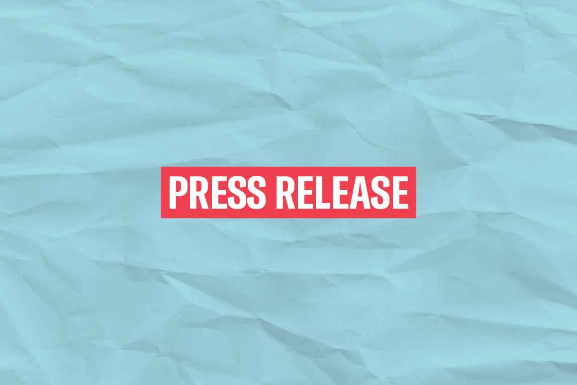 The words 'Press Release' in white font on a red rectangle on an azure paper texture background